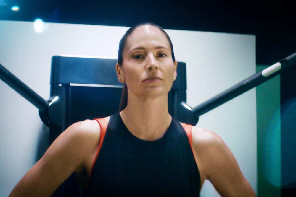 sue bird stands in front of her tonal looking strong