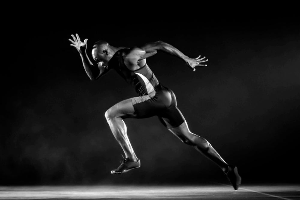 a black and white image of a man running