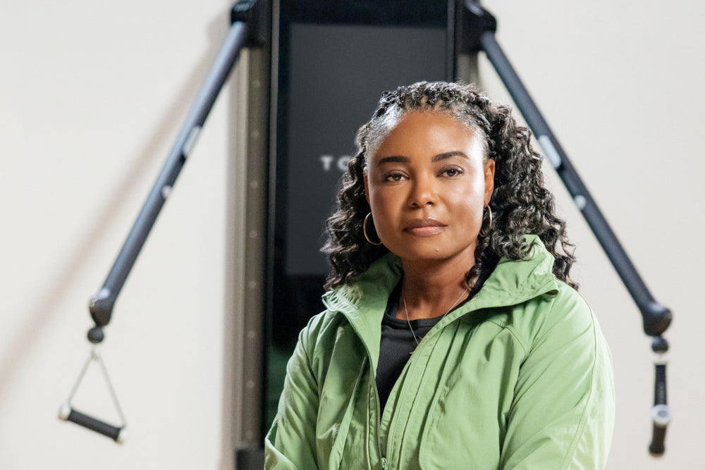 Nigeria Moore sitting in front of Tonal.