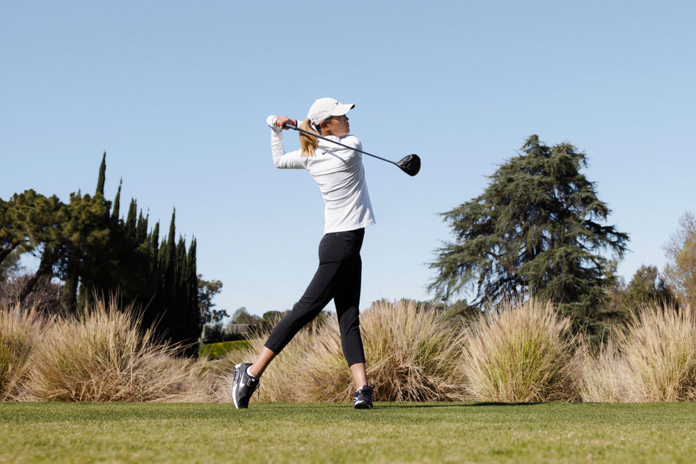 Michelle Wie West swinging a golf club.