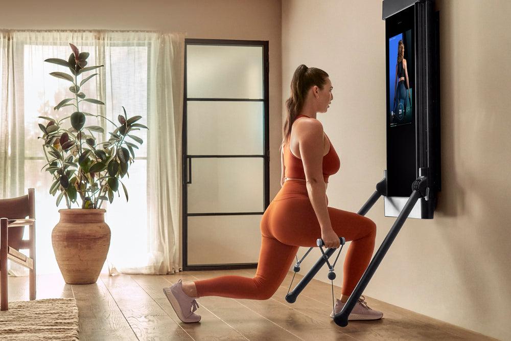 a woman working out on Tonal