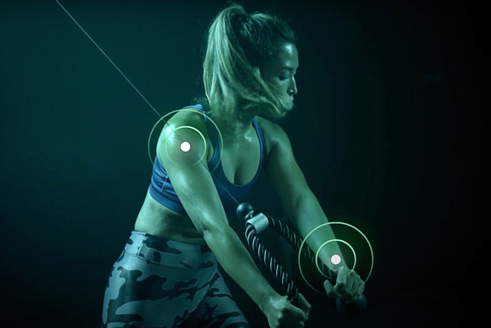 women working out on tonal to demonstrate form feedback