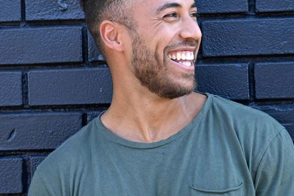 a man smiling and laughing