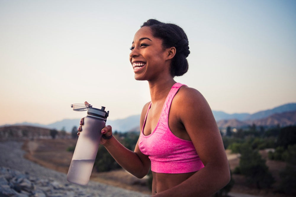 non-scale victories; woman with water bottle