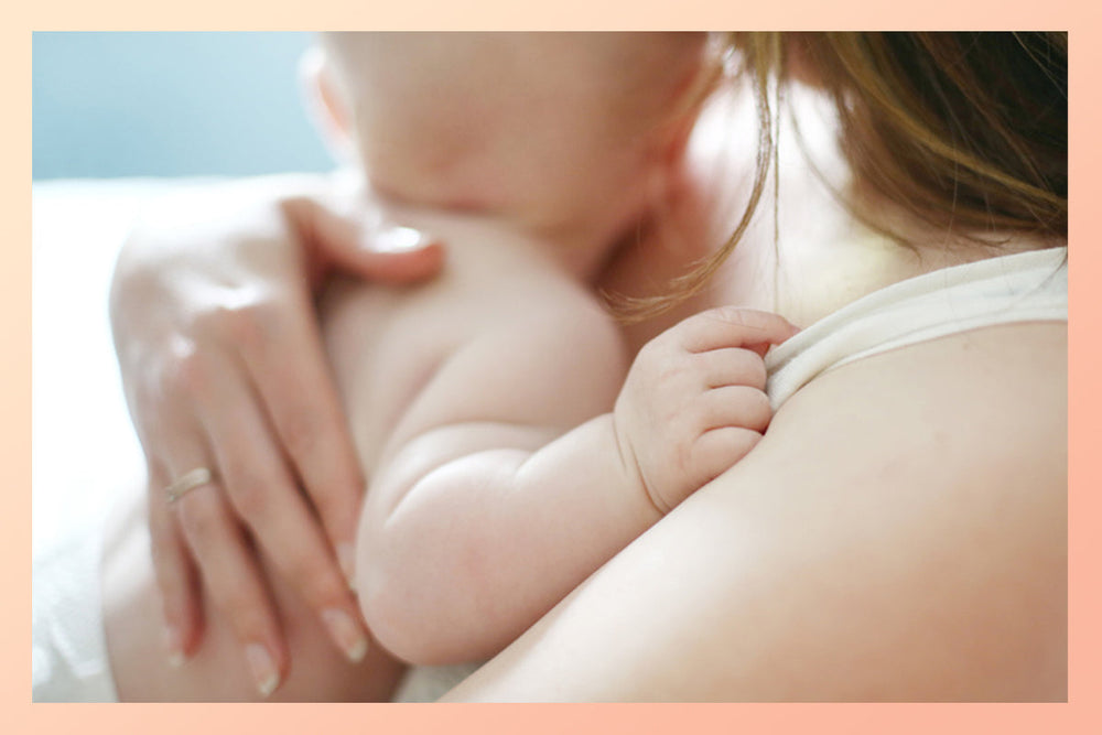 A woman with her baby, ready to ease back into postpartum exercise