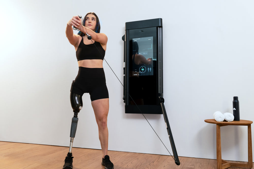 Brenna Huckaby workouts out at home on Tonal.