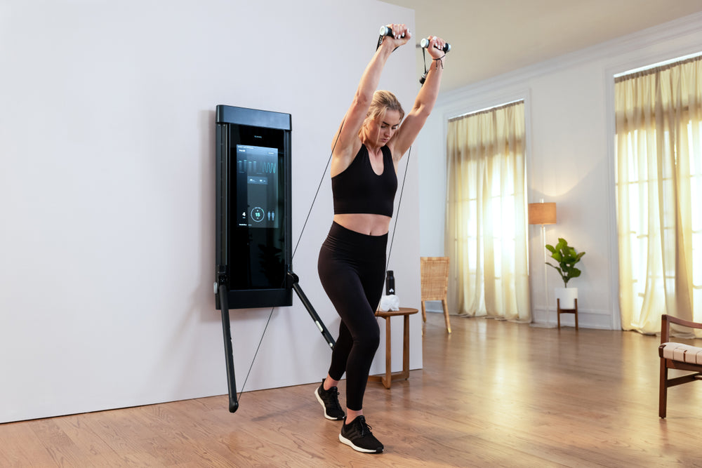 Soccer player Lindsey Horan performing incline chest press on Tonal.