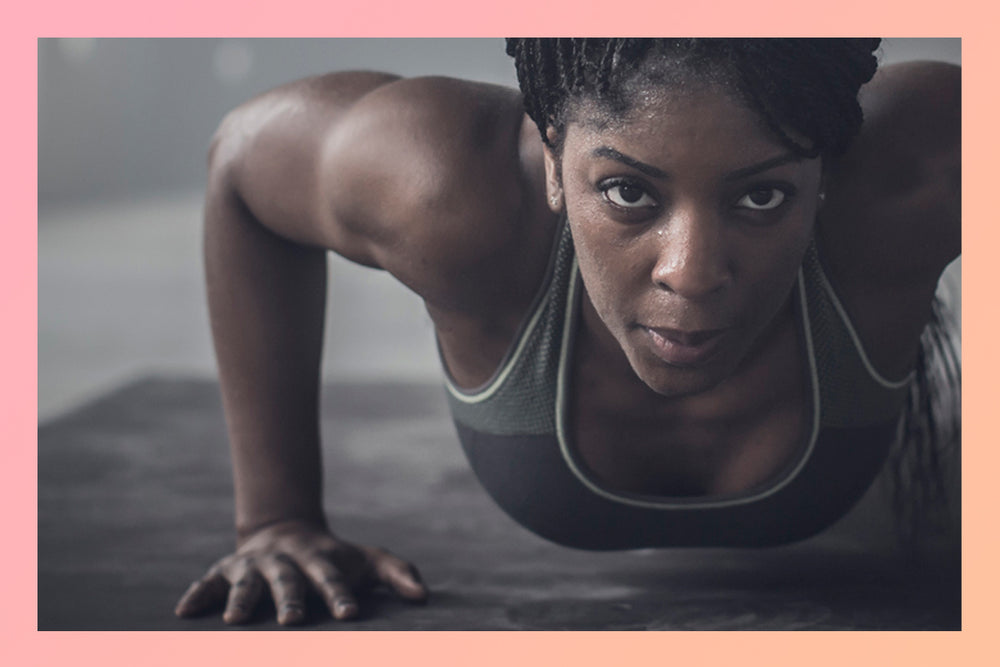 Woman doing a pushup.