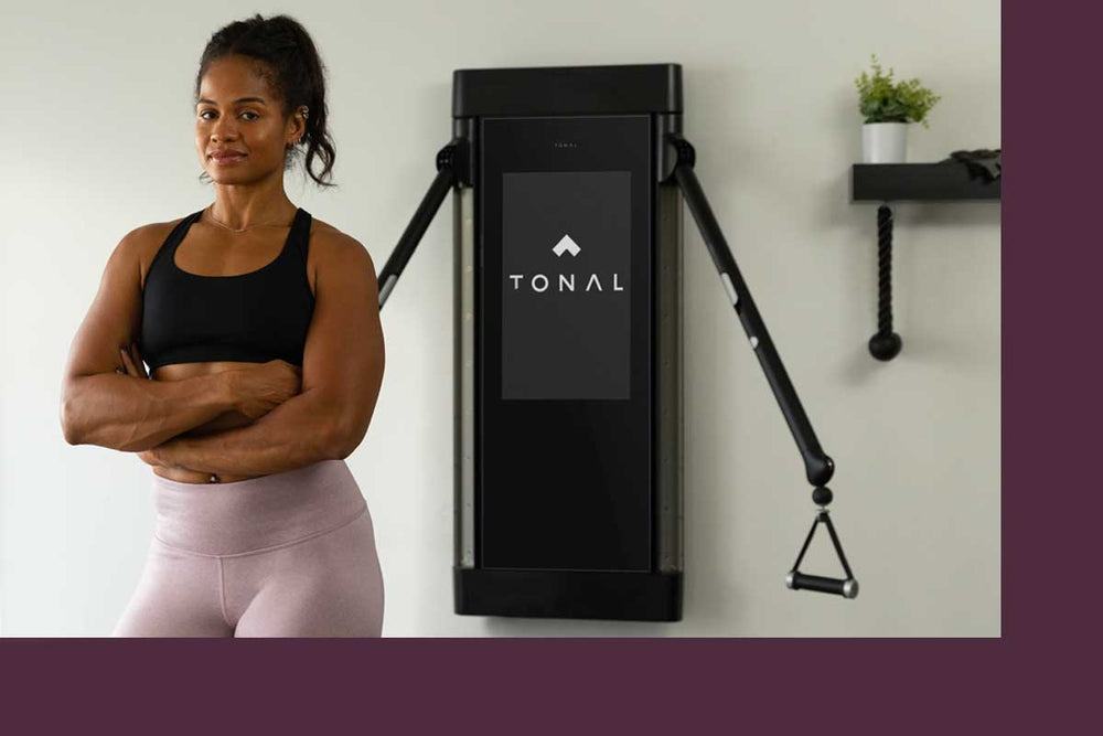 Michelle Tee shown in front of her Tonal.