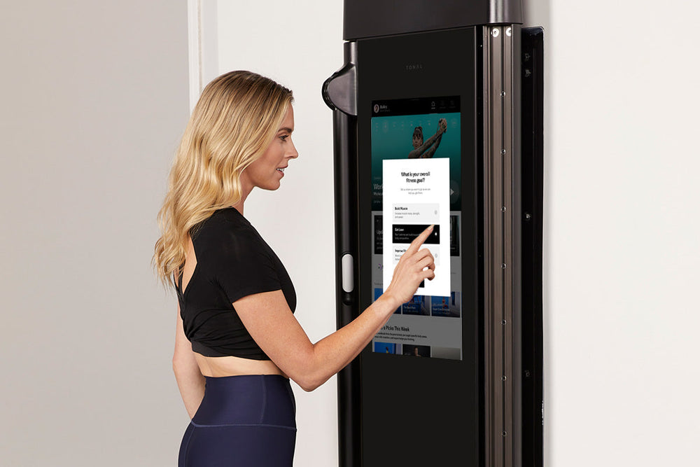 Coach Ash Wilking choosing her training goals on Tonal.