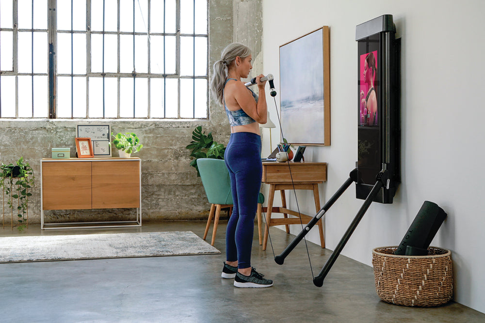 older woman strength training at home for healthy aging