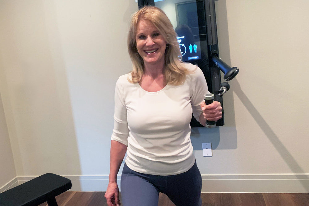 a woman strength training with tonal