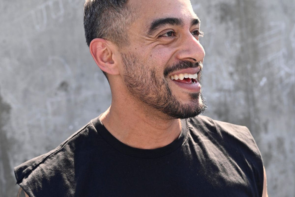 image of a man smiling in side profil