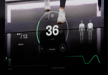 Digital display of tonal showing reps, modes, and muscle group focus