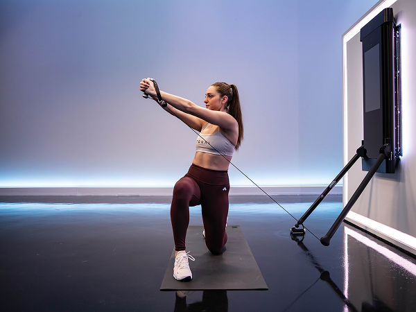 Tonal instructor doing half kneeling lift

