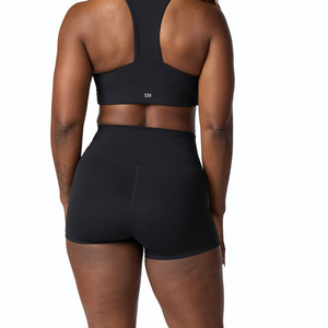 Woman wearing Tonal x Splits59 Airweight 3.5 inch short in Black