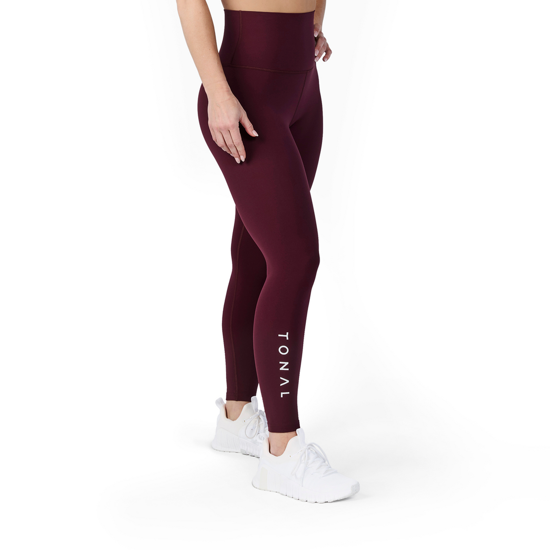 Woman wearing Tonal x Splits59 Airweight Super High Waist 7/8 Legging in Dark Cherry