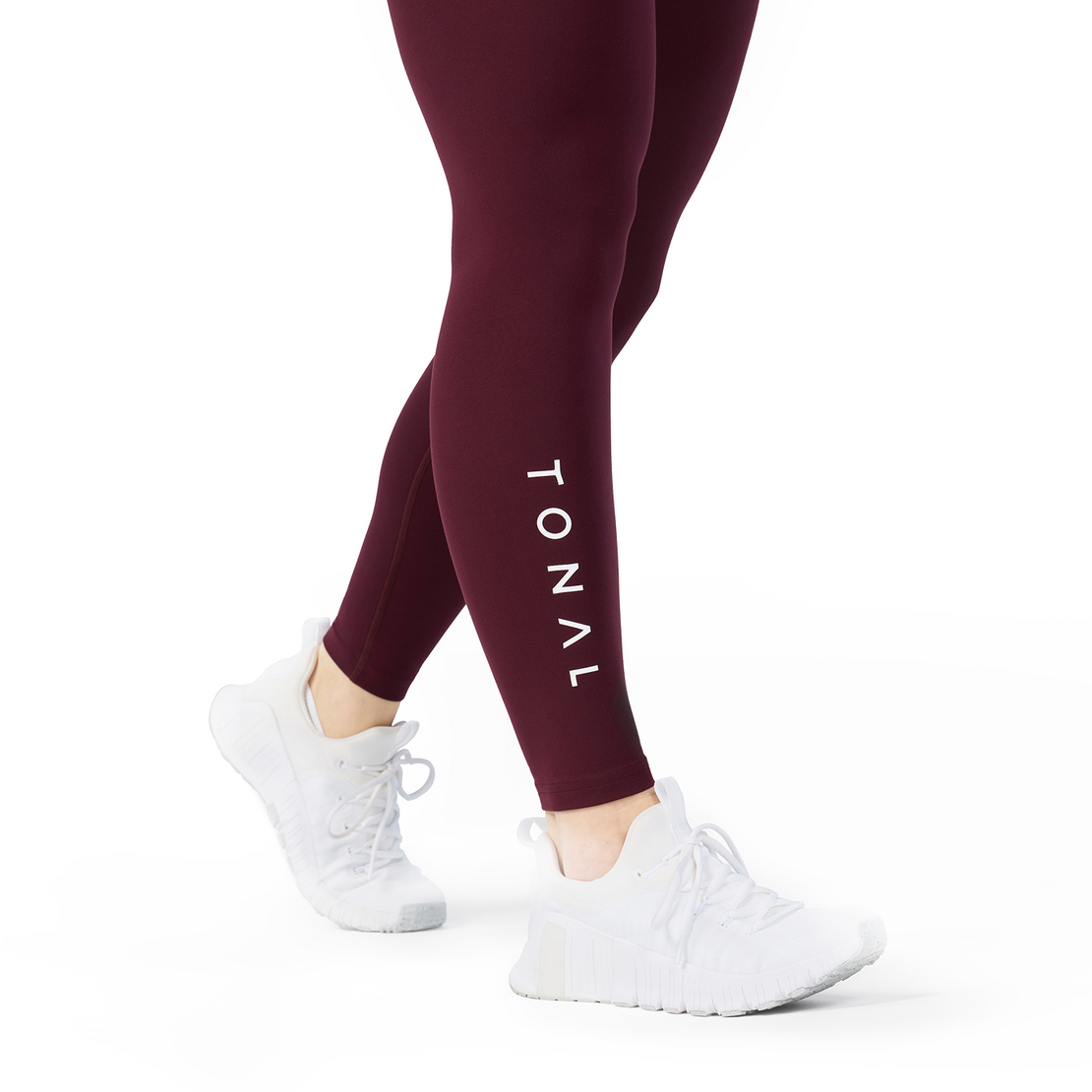 Woman wearing Tonal x Splits59 Airweight Super High Waist 7/8 Legging in Dark Cherry