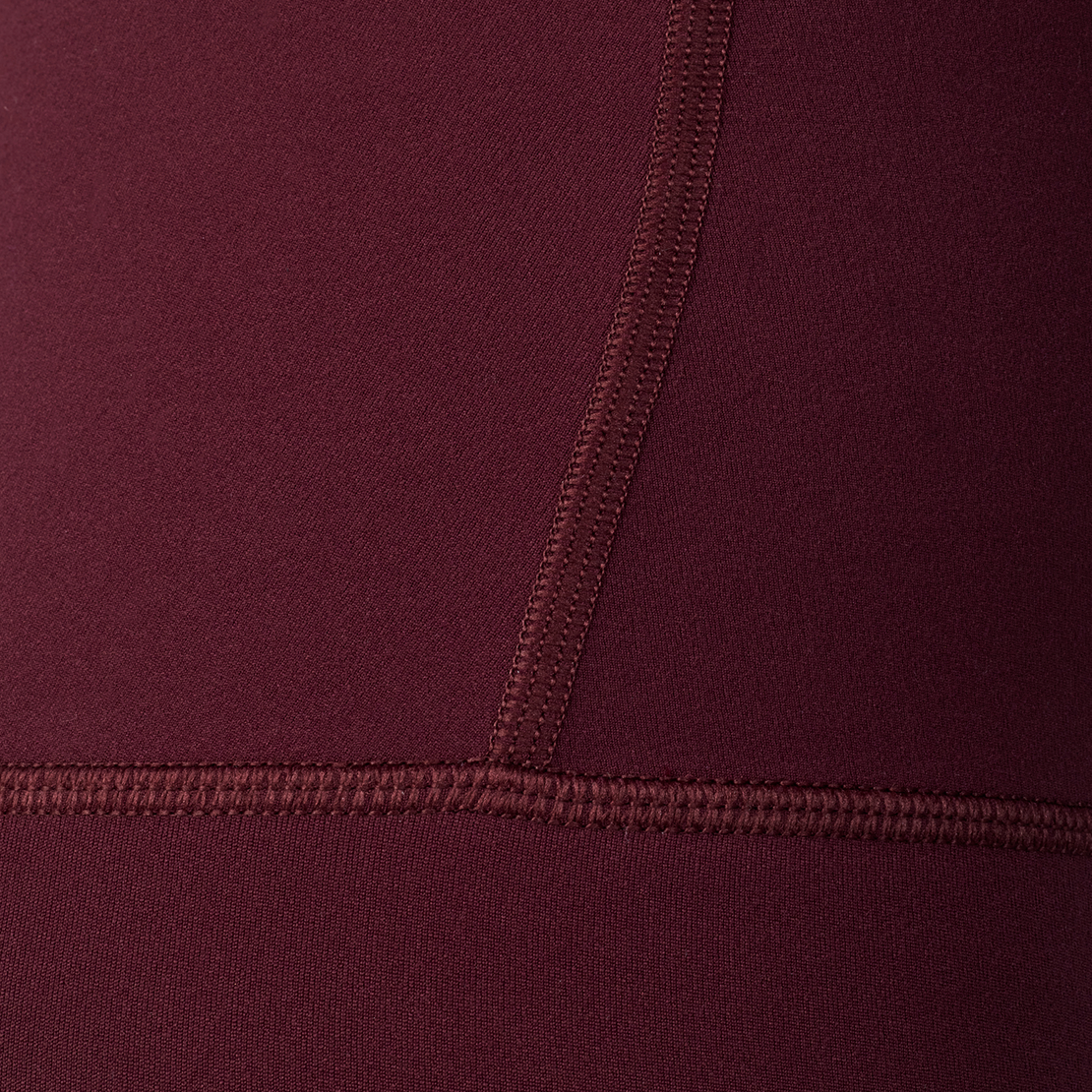 Woman wearing Tonal x Splits59 Airweight Super High Waist 7/8 Legging in Dark Cherry