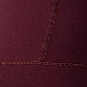 Woman wearing Tonal x Splits59 Airweight Super High Waist 7/8 Legging in Dark Cherry