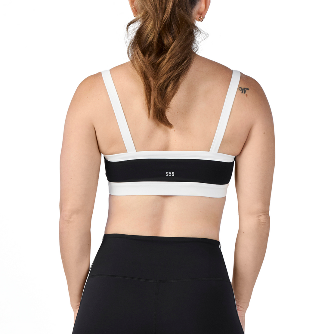 Woman wearing Tonal x Splits59 Monah Rigor Sports Bra in Black and White