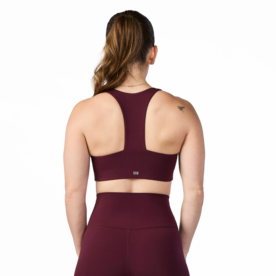Woman wearing Tonal x Splits59 Sarah Airweight Bra in Dark Cherry