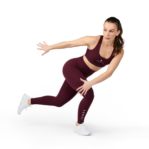 Woman wearing Tonal x Splits59 Sarah Airweight Bra in Dark Cherry
