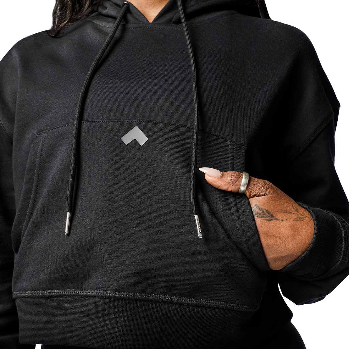 Close up of Tonal Performance crop hoodie fabric and and front pocket