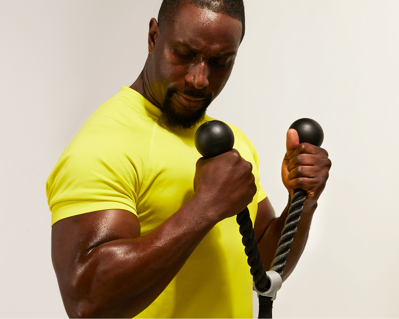 Tonal Coach Ackeem Emmons using Drop Sets  during hammer curls.