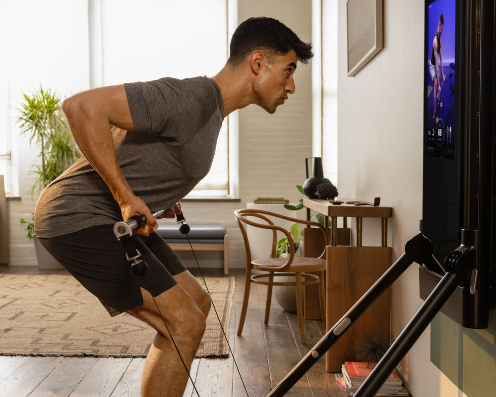 Tonal member performing Barbell Bent Over Rows