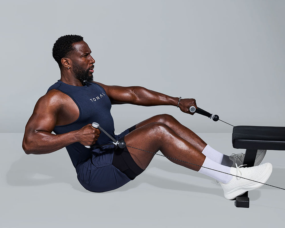 Tonal Coach Ackeem performing a Seated Cable Row