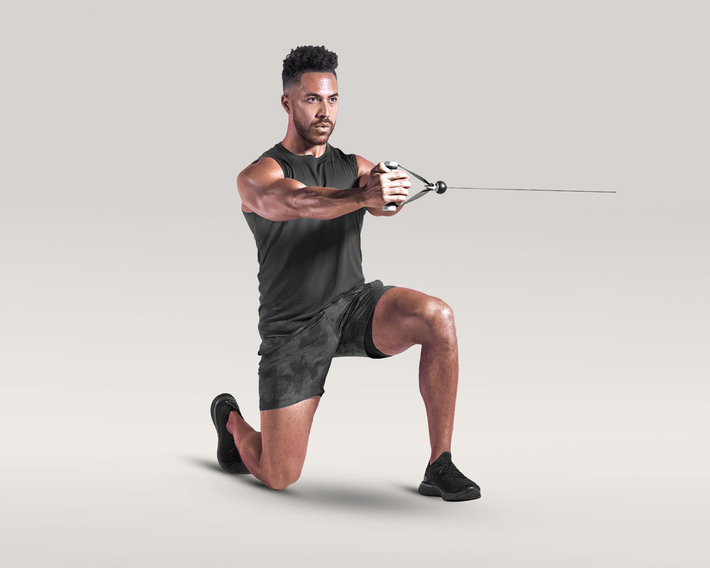 Tonal coach performing a Half Kneeling Pallof Press