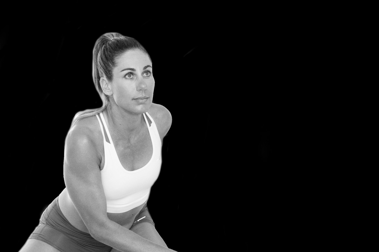 black and white image of a woman working out