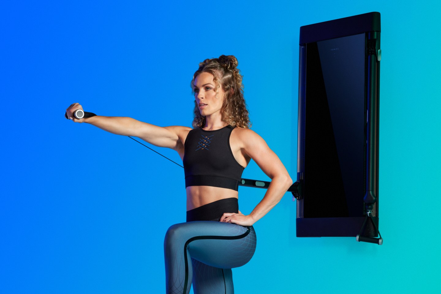 a woman working out on tonal