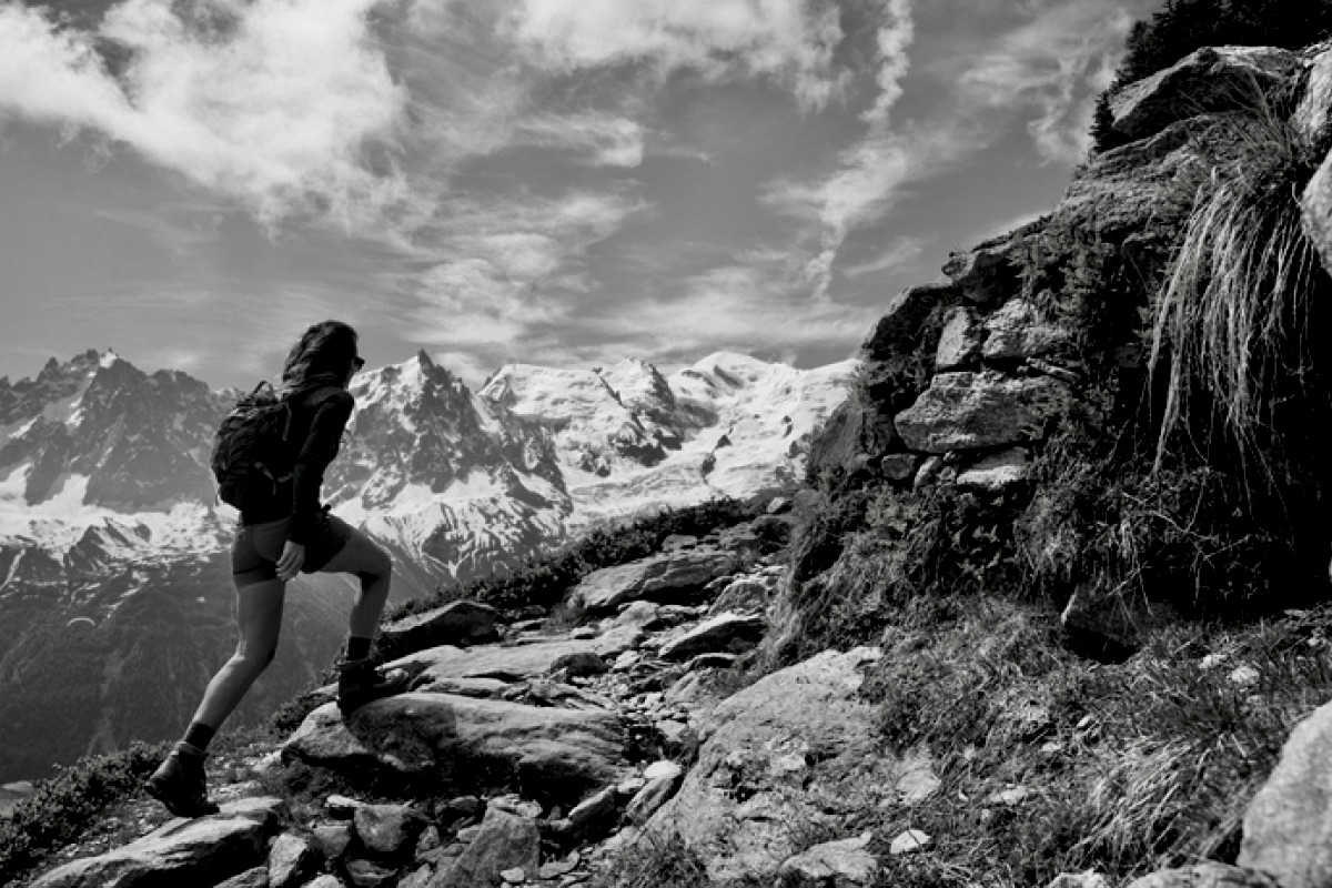 woman hiking up a mountain