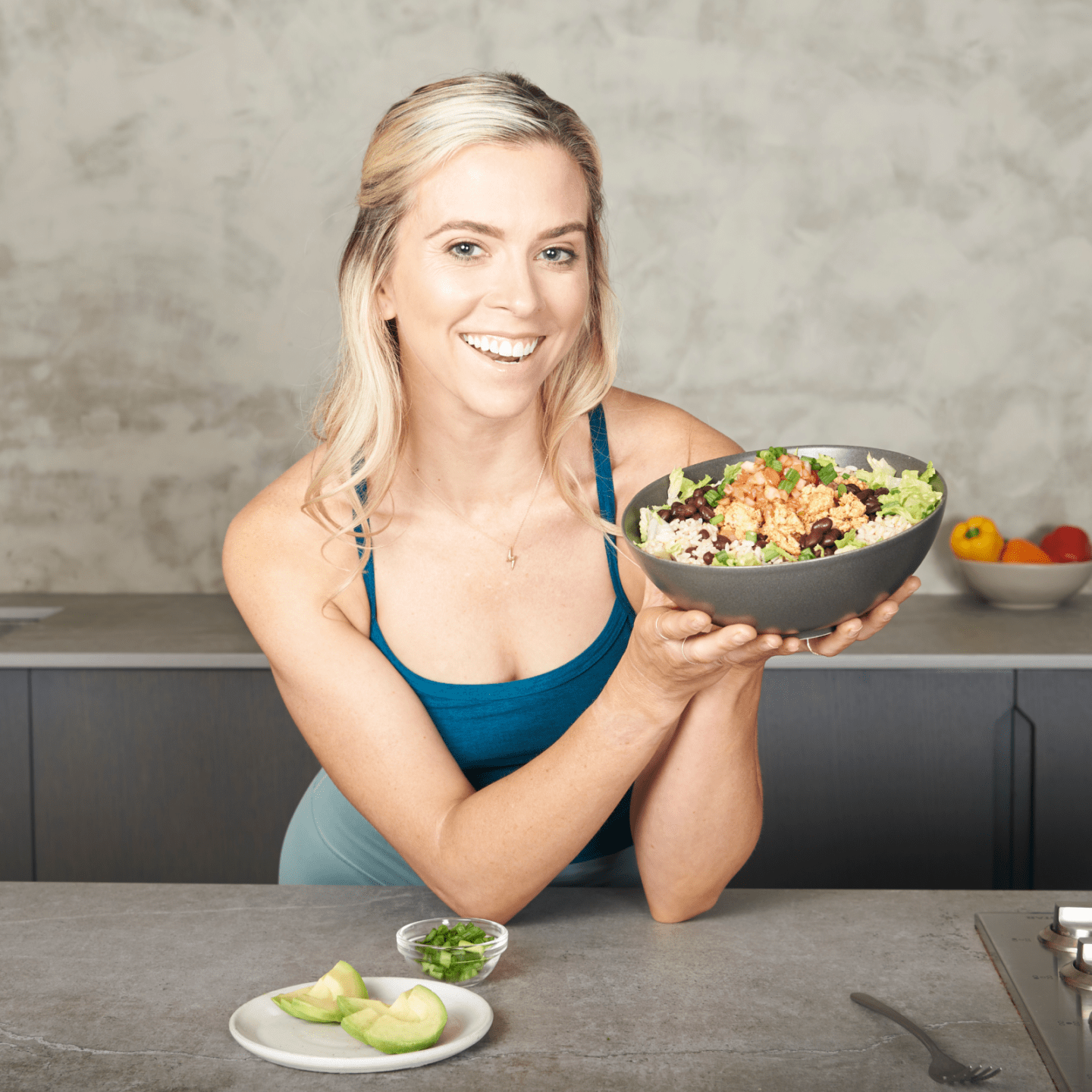 Coach Ash Wilking showing off her ground chicken taco bowl