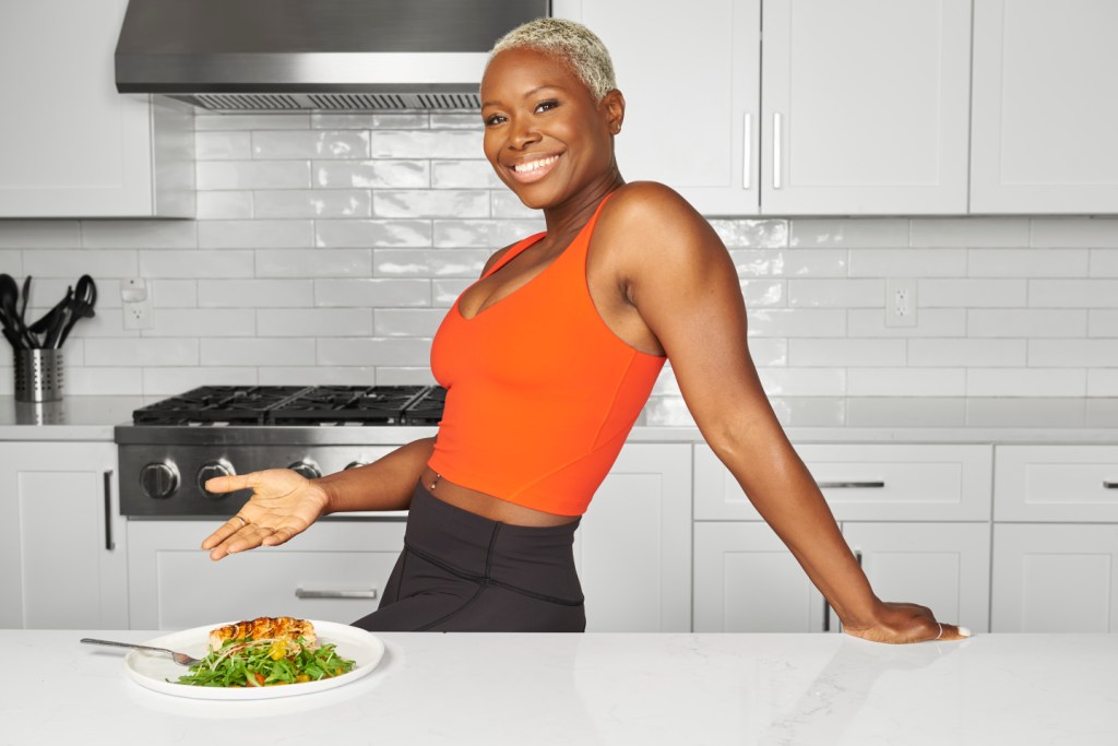 Coach Tanysha Renee with grilled fish and arugula salad